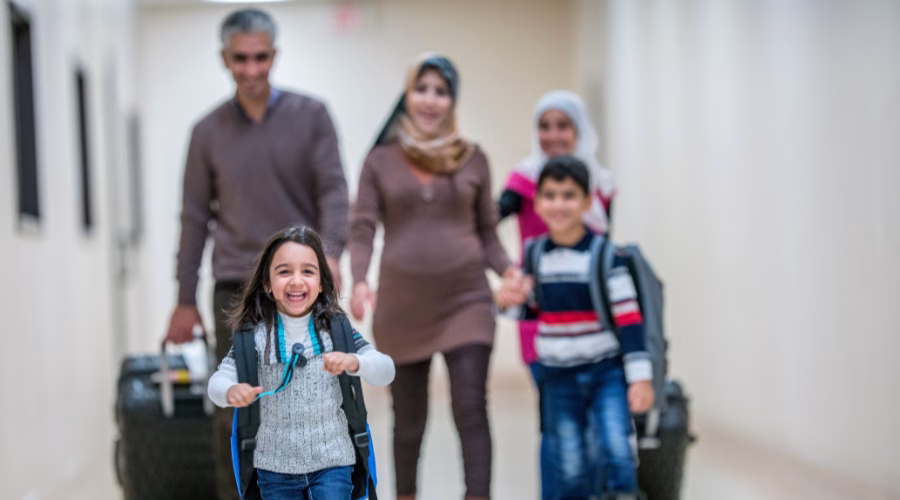 A family walking with luggage