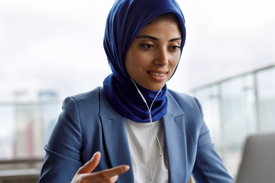 woman on a video call wearing headphones