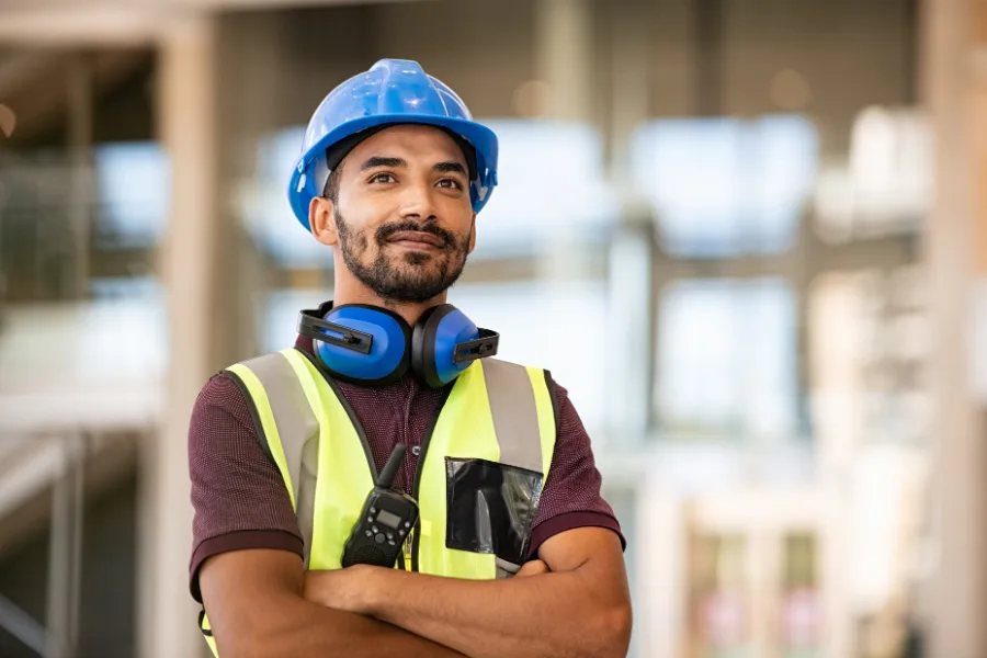 a woman wearing safety equipment at a job site